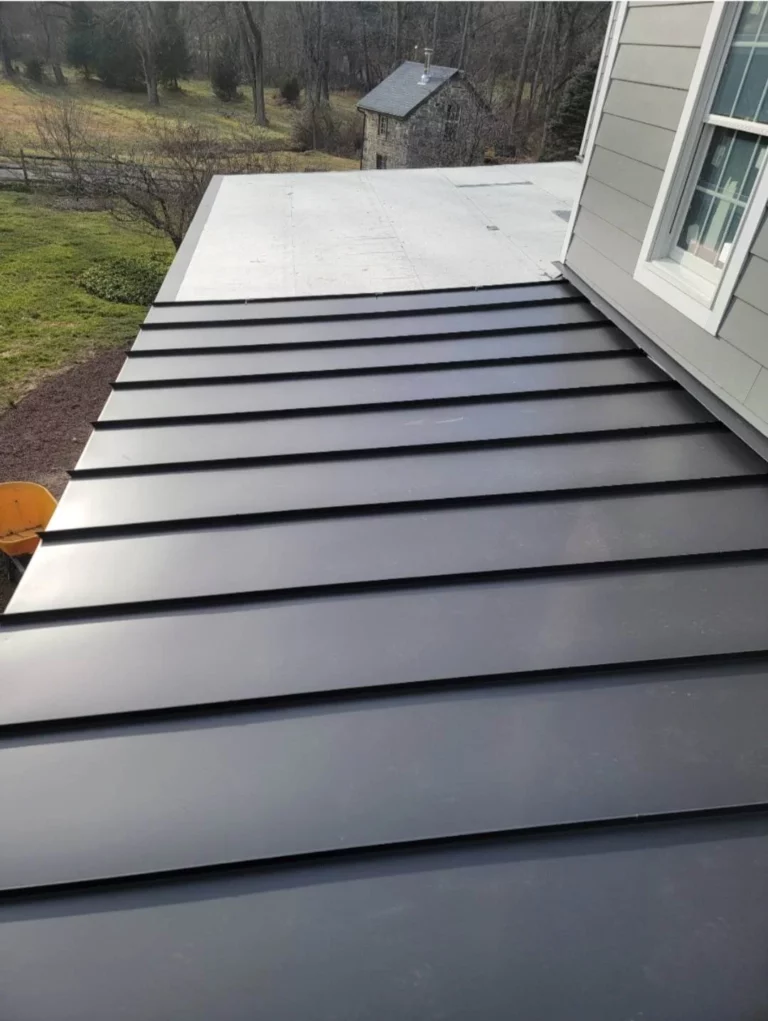 Installing vinyl siding on a house during renovation