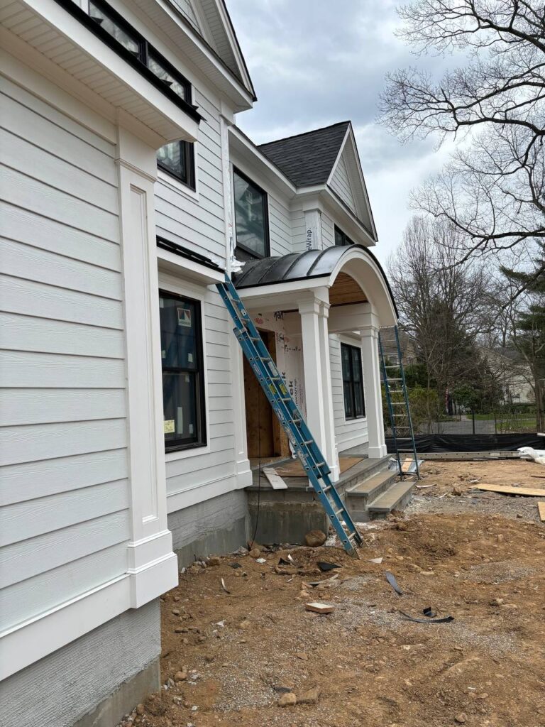 Side view of a building with metal panels installed on the roof