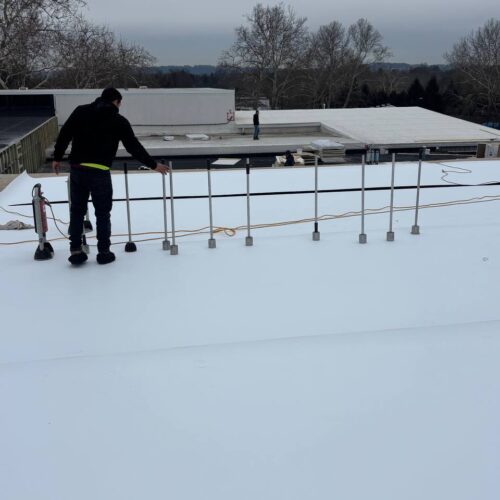 Mechanically attached Flat Roof System