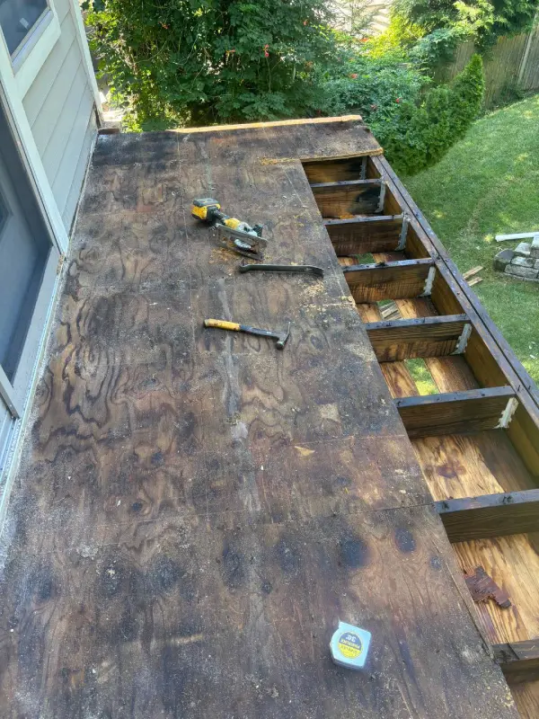 Exposed balcony deck structural framing