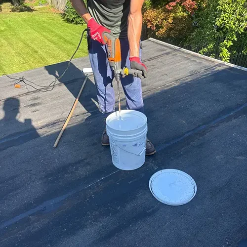 Applying silicone roof coating