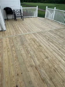 Inspecting exposed wooden deck framing